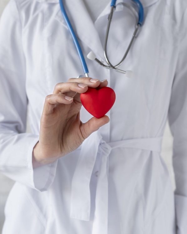 close-up-doctor-holding-red-heart